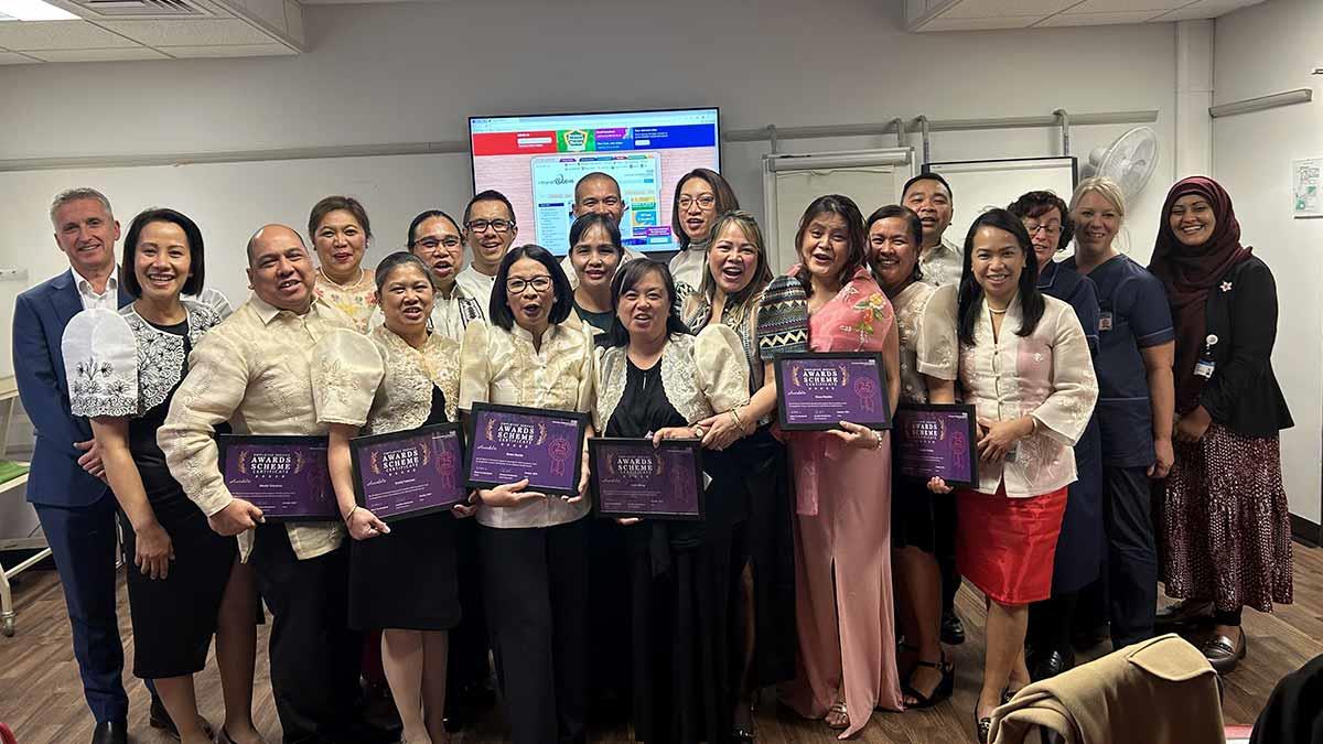 Members the first group of nurses from the Philippines showing off their awards